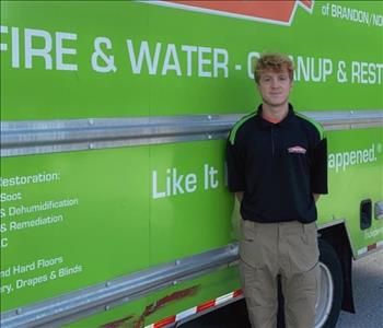 SERVPRO employee in front of service truck